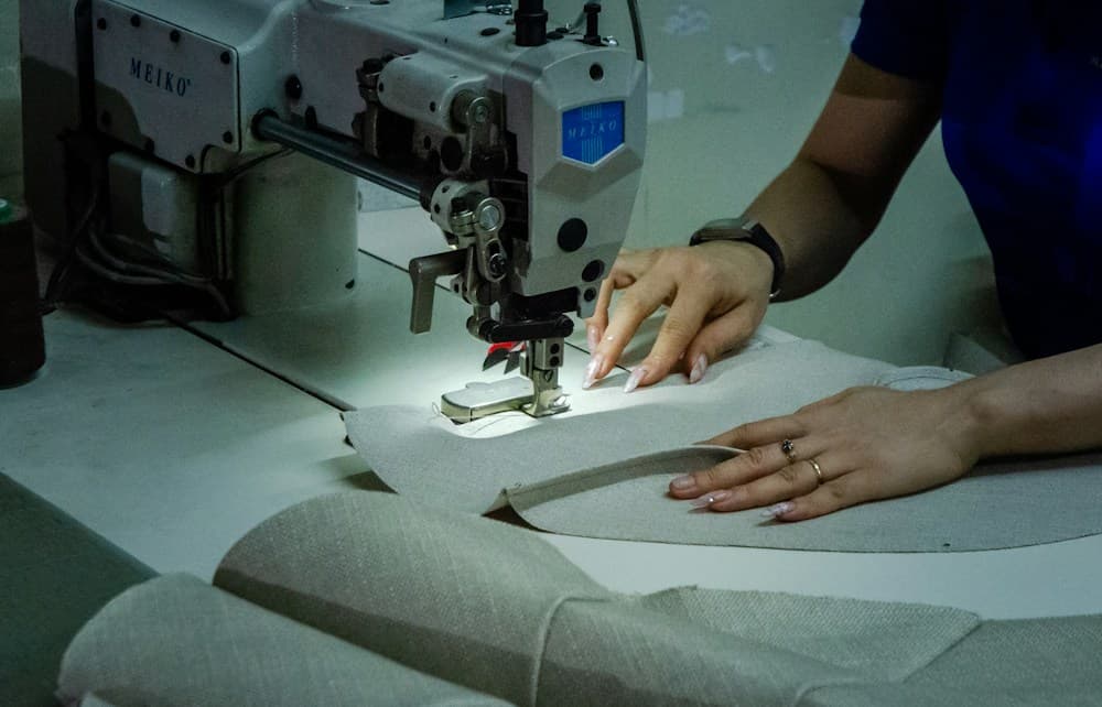 A close-up of textured fabric and sewing materials